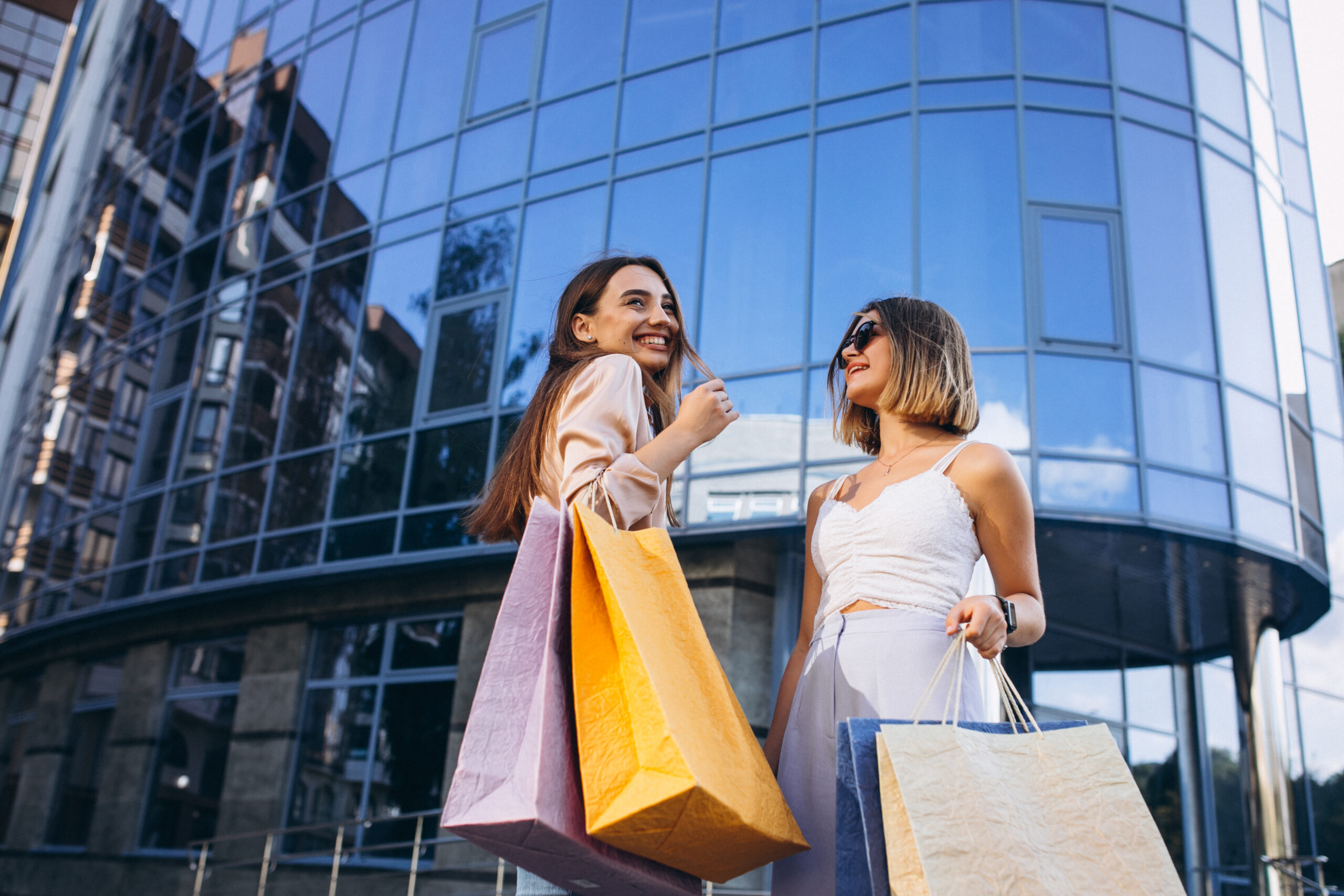 Two beautiful women shopping in town